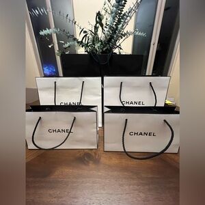 Chanel set of 4 white shopping bags